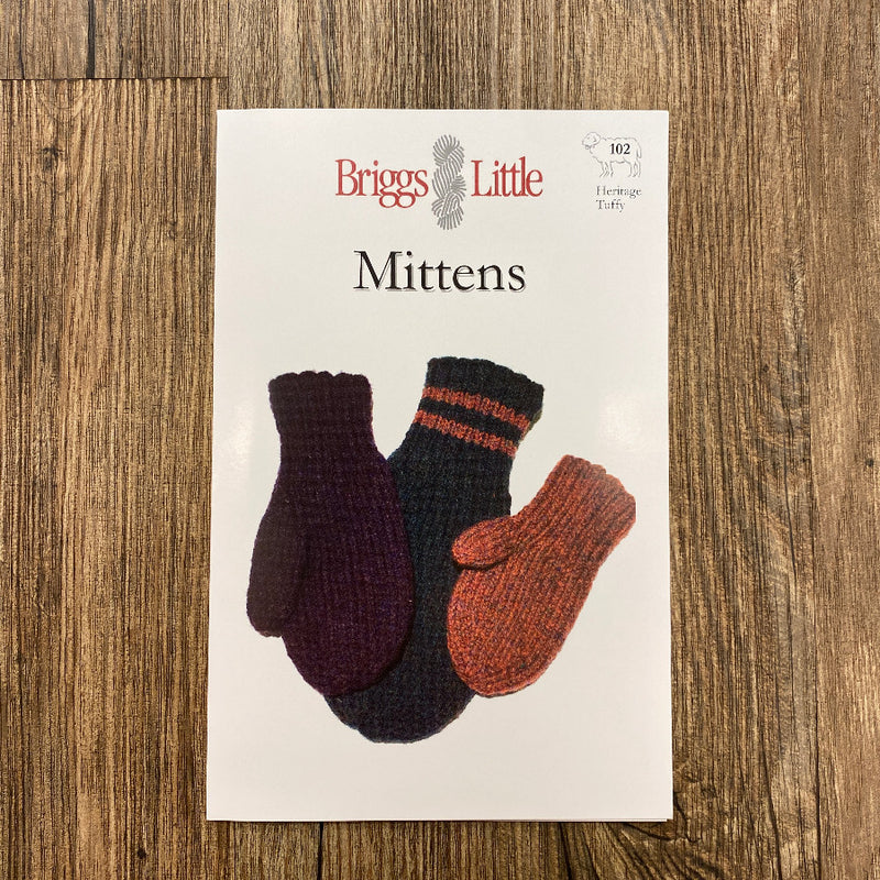 Briggs and Little mittens pattern on a wooden surface