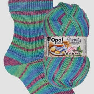 Colorful striped sock and ball of yarn with Opal brand label on a white background