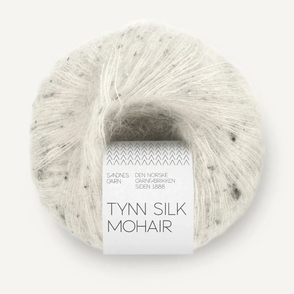 Ball of white Tynn Silk Mohair yarn with dark tweed flecks on a white background
