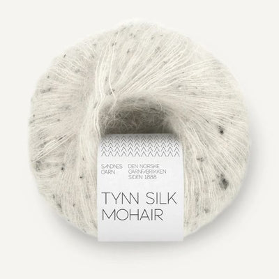 Ball of white Tynn Silk Mohair yarn with dark tweed flecks on a white background