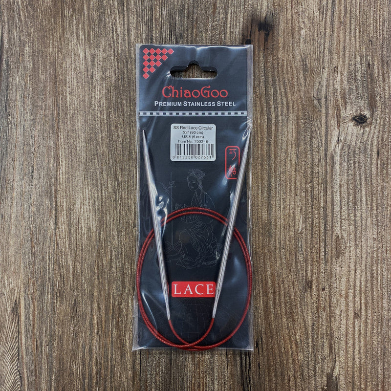 ChiaoGoo stainless steel circular knitting needles in packaging on a wooden surface