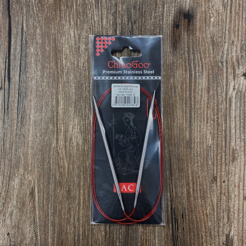 ChiaoGoo premium stainless steel knitting needles in packaging on a wooden surface