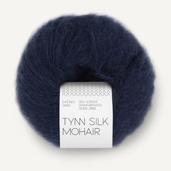 Navy blue skein of yarn with a label on a white background