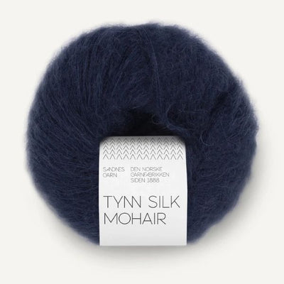 Navy blue skein of yarn with a label on a white background