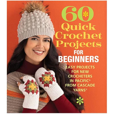 Book cover of '60 Quick Crochet Projects for Beginners' by Cascade Yarns with a woman wearing a crocheted hat and mittens.