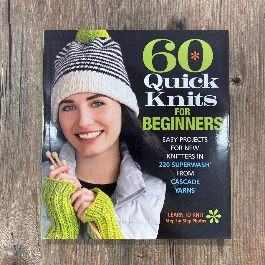 Book cover of '60 Quick Knits for Beginners' on a wooden surface
