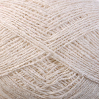 Close-up of cream coloured yarn with a textured pattern