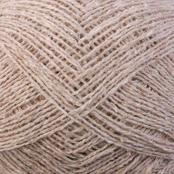 Close-up of beige yarn with a textured pattern