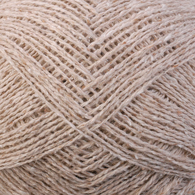 Close-up of beige yarn with a textured pattern