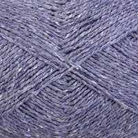 Close-up of pale purple yarn with a tweedy texture