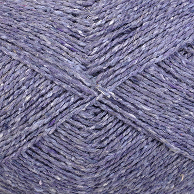 Close-up of pale purple yarn with a tweedy texture