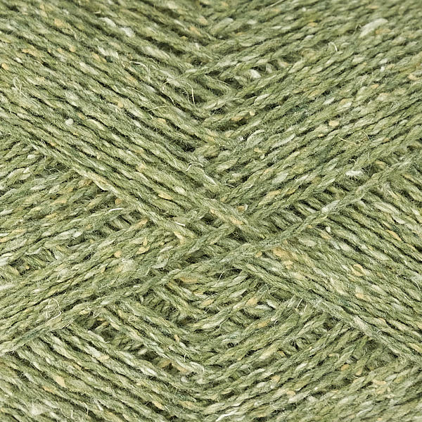Close-up of green yarn with a tweedy textured surface