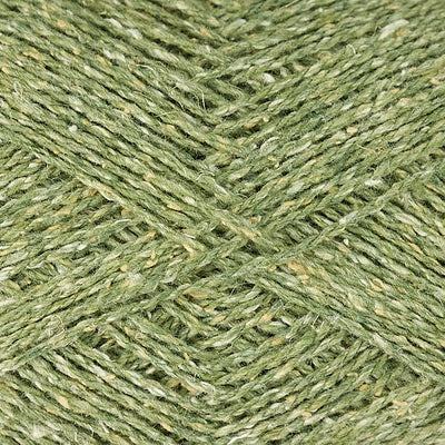 Close-up of green yarn with a tweedy textured surface