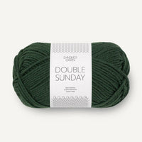Ball of green yarn with a label on a white background