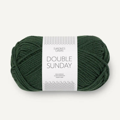Ball of green yarn with a label on a white background