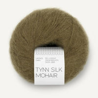 Ball of olive green Tynn Silk Mohair yarn with a label on a white background