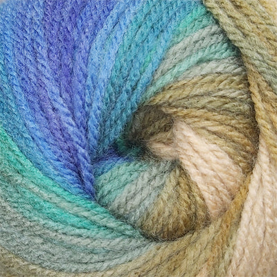Close-up of a skein of yarn with gradient colors from blue to beige.