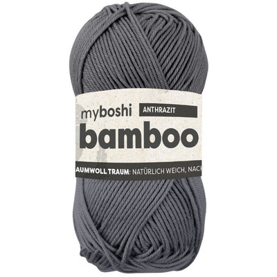 Gray skein of yarn with a label on a white background