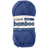 Blue ball of yarn with a label on a white background