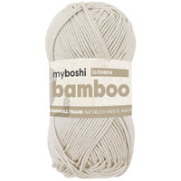 Cream ball of yarn with 'myboshi' label on a white background