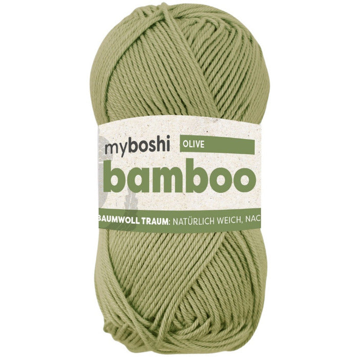 Green ball of yarn with a label on a white background