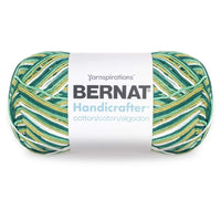 Bernat Handicrafter yarn ball with green and yellow pattern on a white background