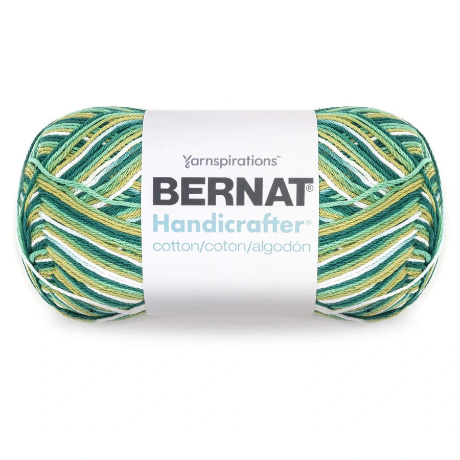 Bernat Handicrafter yarn ball with green and yellow pattern on a white background
