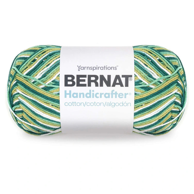 Bernat Handicrafter yarn ball with green and yellow pattern on a white background