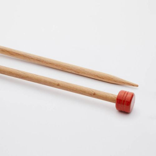 Two wooden knitting needles with red ends on a white background