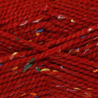 Close-up of red yarn with multicolored specks