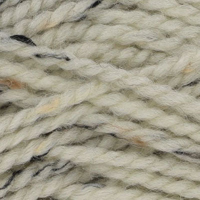 Close-up of cream yarn with brown and black specks