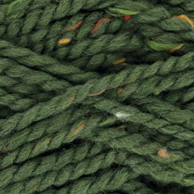 Close-up of green yarn with orange, green, and yellow specks