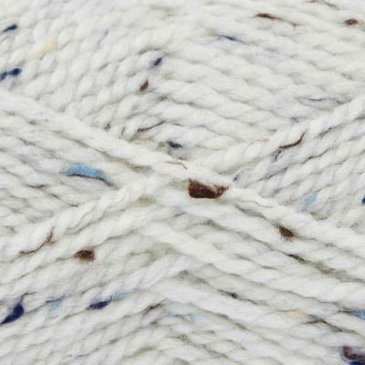 Close-up of white yarn with blue and brown specks