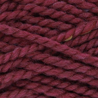 Close-up of dark rose pink yarn with multicoloured specks