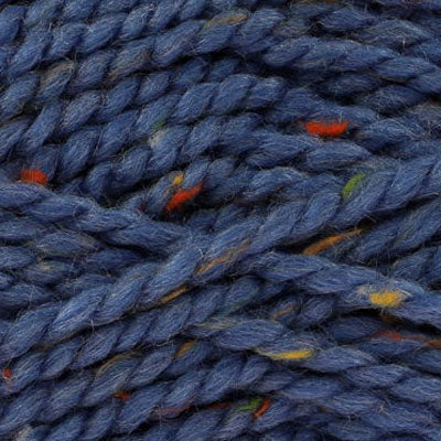 Close-up of blue yarn with green, orange, and yellow specks