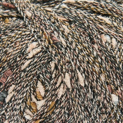 Close-up of textured yarn with brown, beige, and black colors.