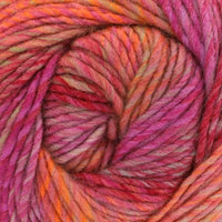 Close-up of a skein of multicolored yarn with hot pink, orange, and red hues.