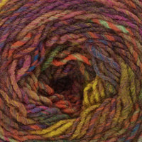 close up of multicoloured yarn in shades of orange, yellow, blue, and purple.