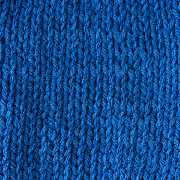 Close-up of bright blue knitted fabric texture