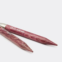 Two wooden knitting needles  on a white background