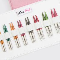 Set of colorful knitting needles in a white case on a white background, featuring the 'KnitPro' brand.