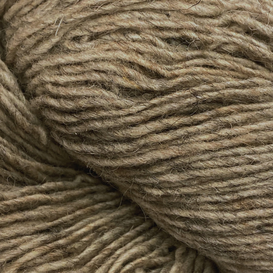 Close-up of a skein of oatmeal yarn