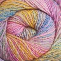 Close-up of a skein of multicolored yarn with pink, yellow, and blue tones.