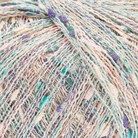 Close-up of pale multicoloured yarn with shades of pale green, purple, and peach.