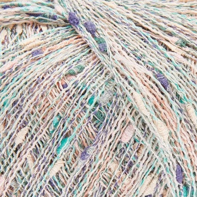 Close-up of pale multicoloured yarn with shades of pale green, purple, and peach.