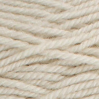 A close-up of pale beige yarn