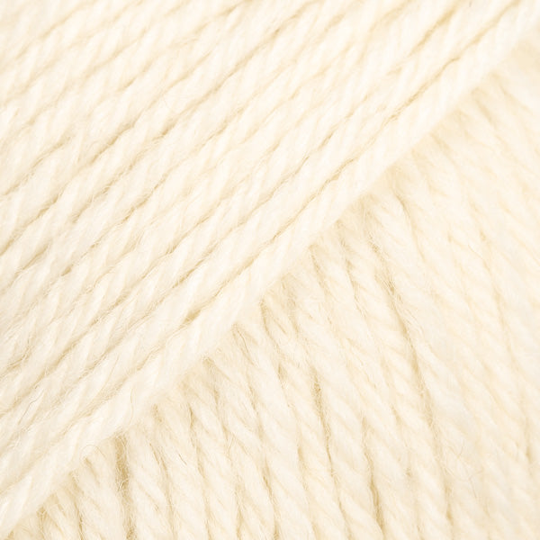 Close up of a ball of off-white yarn