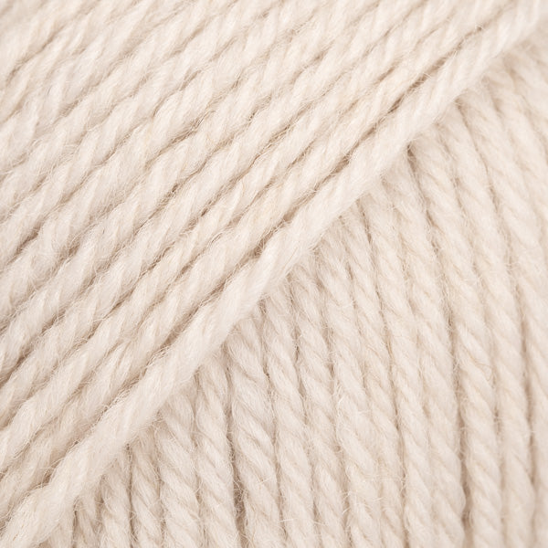 Close-up of pale beige yarn ball