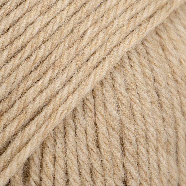 Close-up of beige yarn ball