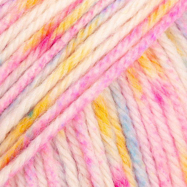 Close-up of multicolored yarn with pink, yellow, and white speckles.